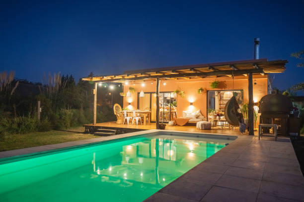 Pool with lights. Night country house.