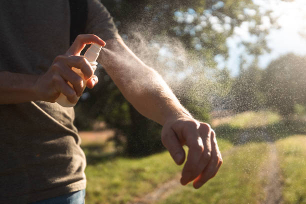 istock Man is applying insect repellent 2161168927