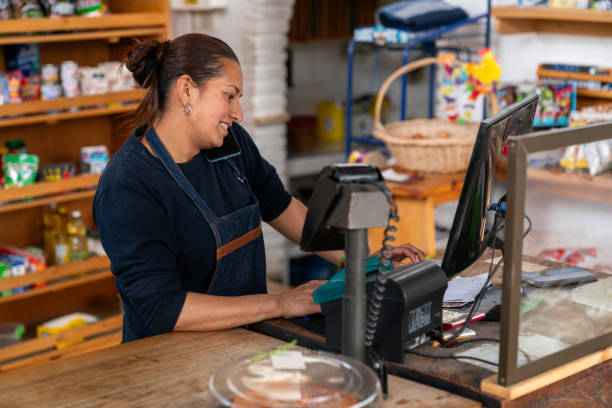 istock Retail clerk taking a delivery order while working at a convenience store 2161171828