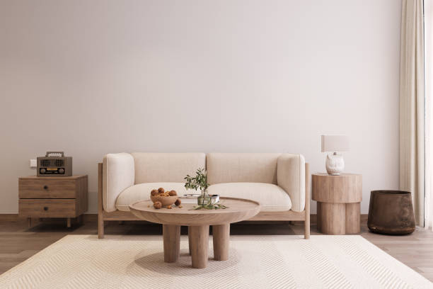 istock Simple and Elegant Couch Behind Wooden Coffee table on the White rustic Mate, White Wall Paint, Lamp on the console table next to the Window 2161171917