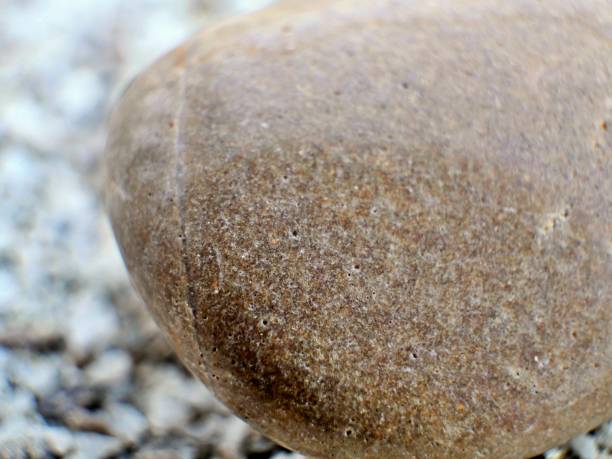 Close up of rugged rock surface with unique weathered textures and natural patterns.