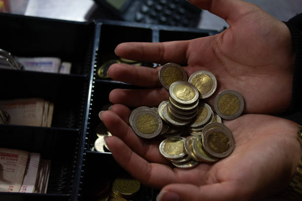 istock Person with Colombian coins 2161187337