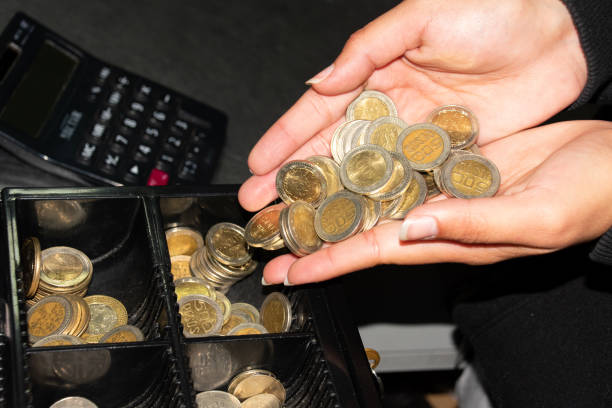 istock Person with Colombian coins 2161187398