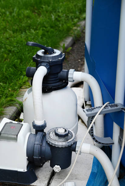 istock Sand filter system next to a pool in your own garden 2161189271