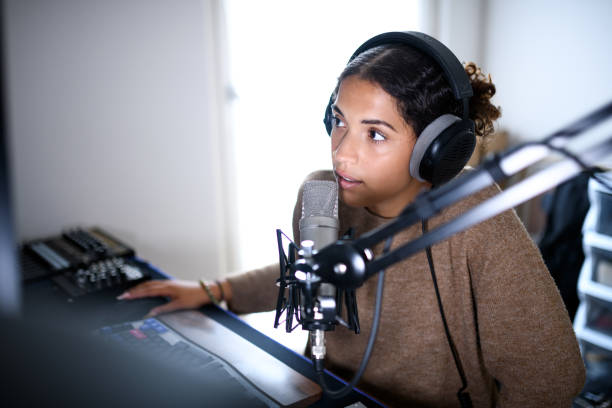 istock Woman recording a streaming podcast 2161191092