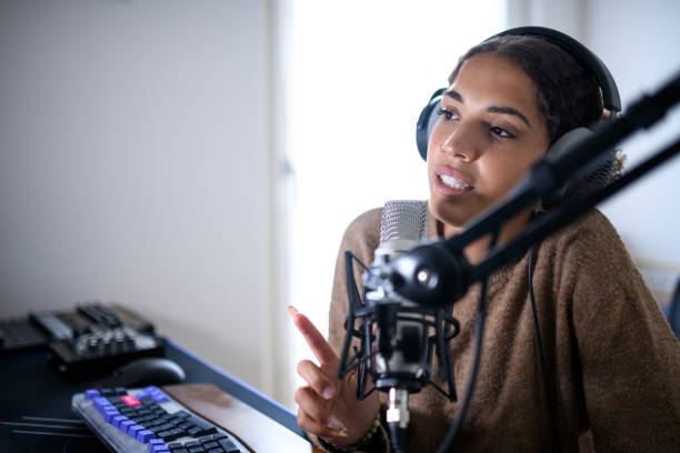 istock Woman recording a streaming podcast 2161191132