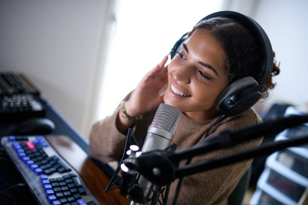 istock Woman recording a streaming podcast 2161191198