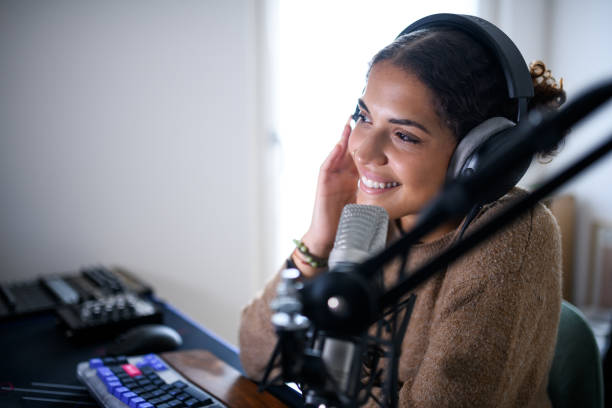 istock Woman recording a streaming podcast 2161191811