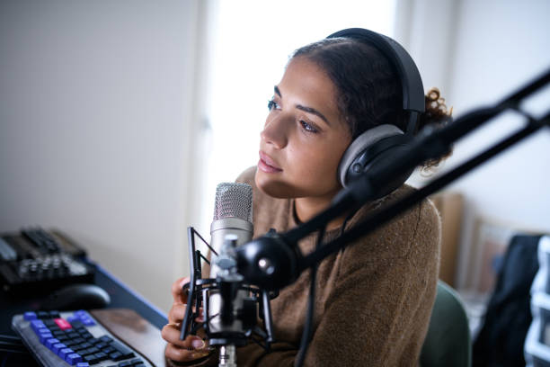 istock Woman recording a streaming podcast 2161191852