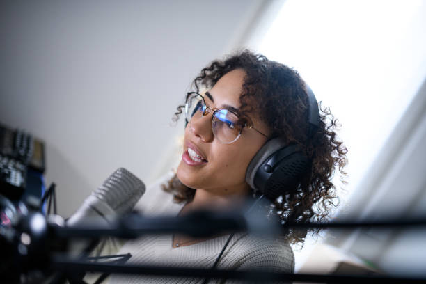 istock Woman recording a streaming podcast 2161191923