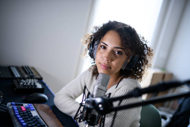 istock Woman recording a streaming podcast 2161192006