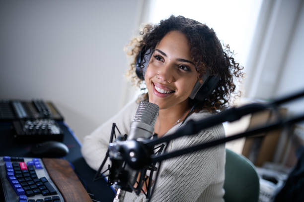 istock Woman recording a streaming podcast 2161192064