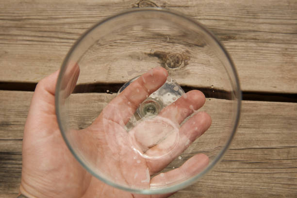 istock A hand holding a glass empty of beer 2161193125