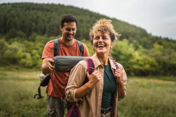 istock Boyfriend help his girlfriend to pack equipment into her backpack 2161193895