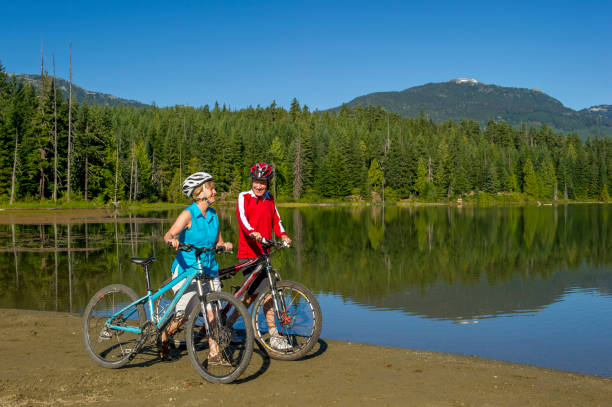 istock Senior couple explore lakeshore together 2161193979