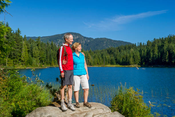 istock Senior couple explore lakeshore together 2161194002