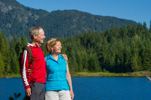 istock Senior couple explore lakeshore together 2161194008