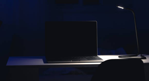 istock Black laptop screen in a dark room at night. 2161194651