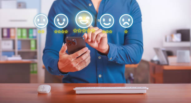 istock Customer Service Feedback. User rating a satisfactory customer service survey on mobile device in modern office. Concept of customer satisfaction and service quality evaluation 2161194728
