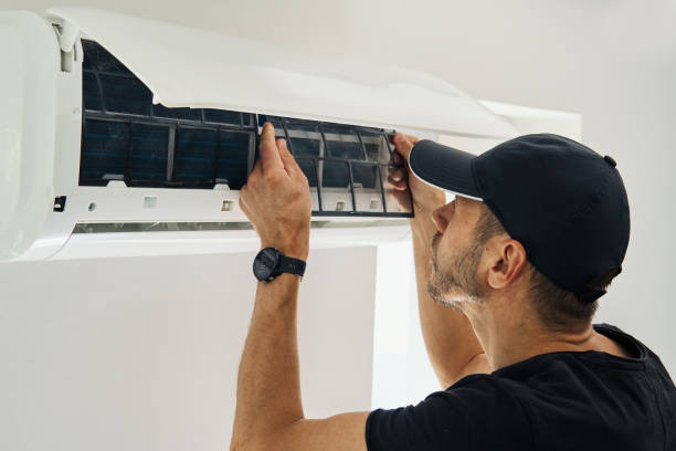 istock Air conditioner maintenance. Male technician repairing cooling system 2161195036