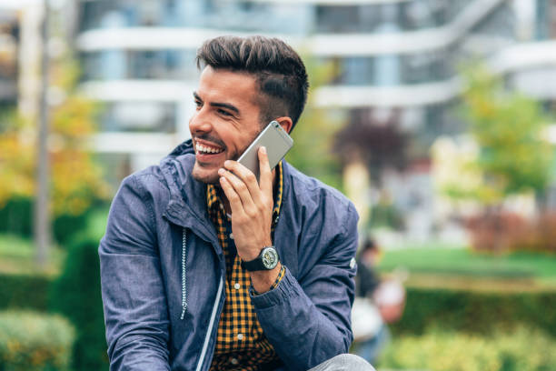 istock Young man talking to the phone 2161195652