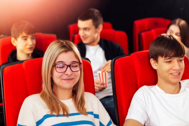 istock Nice young people in the cinema hall. 2161198879