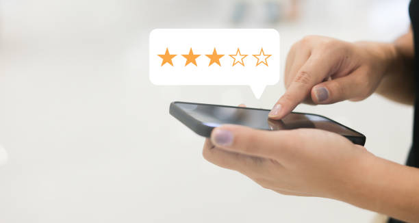 istock close up on customer man hand pressing three star (neutral rating) feedback rank for give score point to review the service and experience on business concept 2161203273