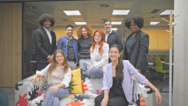 istock Diverse business team posing together in a modern office setting. 2161204241