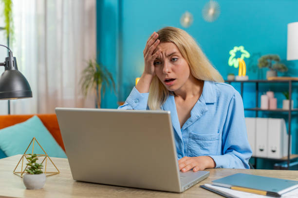 istock Frustrated woman having software problems with laptop angry girl nervous seeing error mistake virus 2161210360