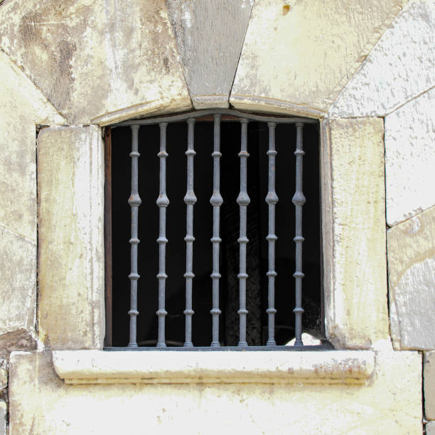 istock Aged Elegance Vintage Window Grill and Stone Frame 2161210459