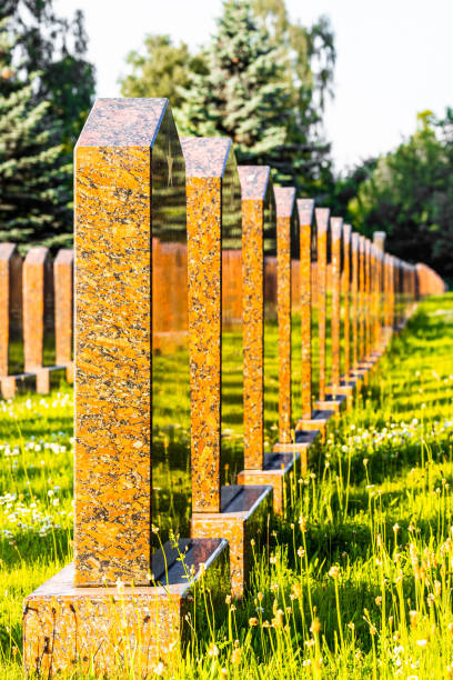 istock alley in the cemetery with the same type of monuments, vertical photo 2161211366