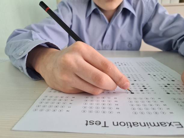 istock A Student Taking A Multiple Choice Examination Test With A Pencil 2161213969