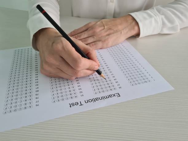 istock A Person Taking a Multiple Choice Examination Test With a Pencil 2161214743