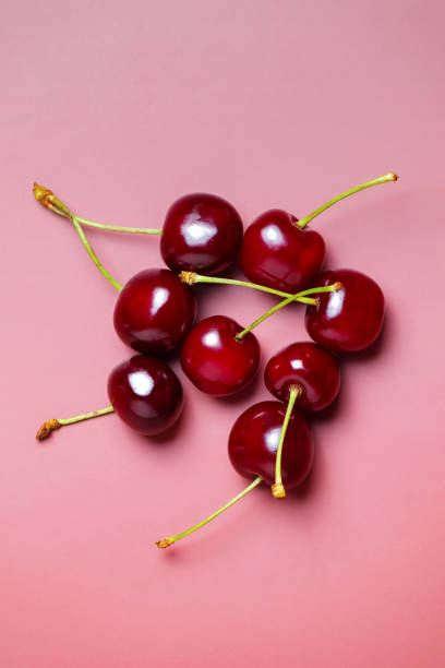 istock Sweet juicy cherries on a pink background 2161214905