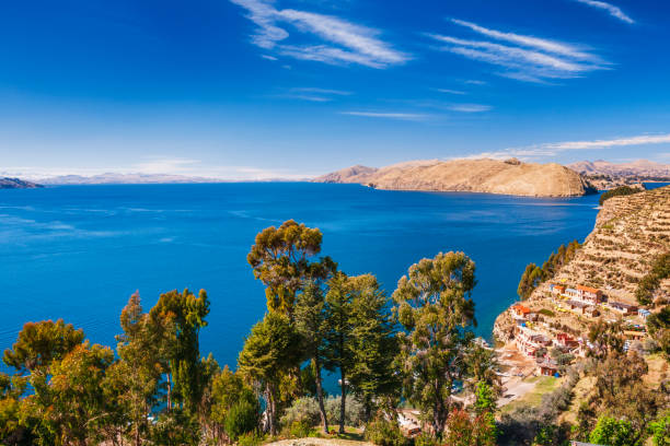 View from Isla del Sol (Island Of The Sun), Lake Titicaca, Bolivia. Isla del Sol is an island in the southern part of Lake Titicaca. It is part of the modern Plurinational State of Bolivia. Titicaca is a highest navigable lake in the Andes on the border of Bolivia and Peru. Lake Titicaca  it is also the largest lake in South America.