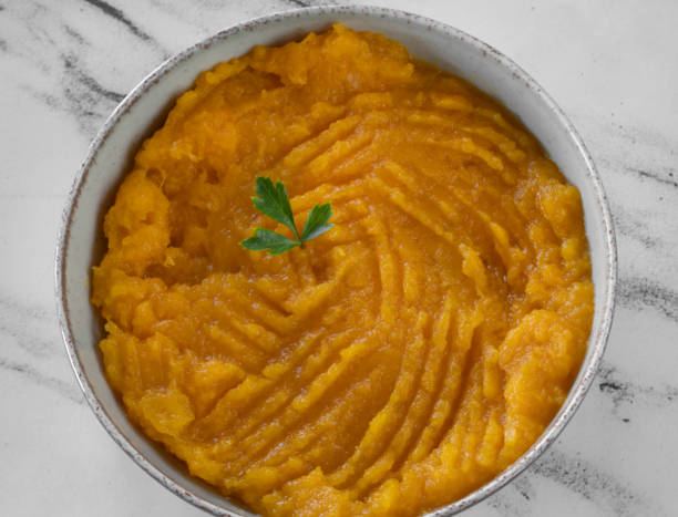 istock Pumpkin puree on the white marble table 2161217234