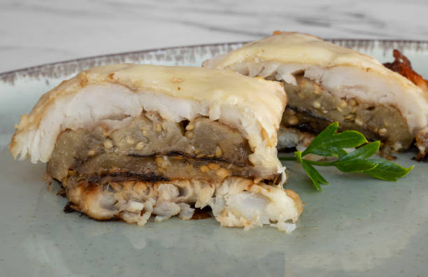 istock View of hake fish filets stuffed with vegetables and melted cheese 2161217571