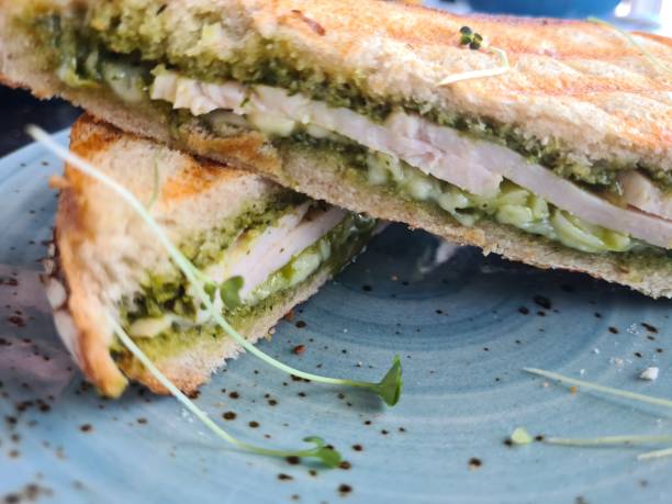Grilled Pesto and Chicken Sandwich on a Blue Plate