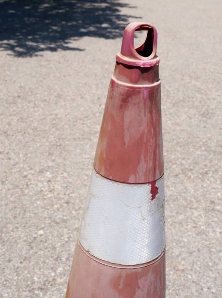 istock old dirty red and white parking cone 2161217757