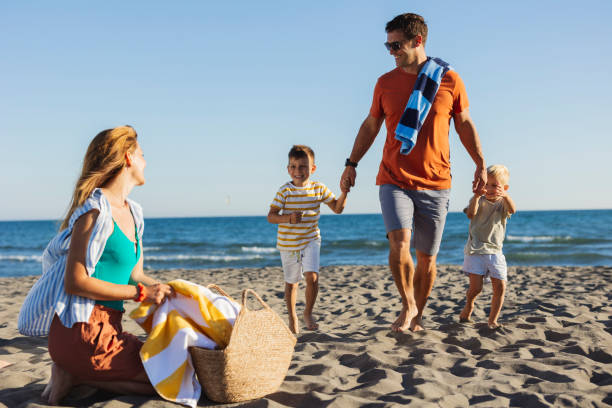 istock Family Enjoying a Beach Day Together 2161217825