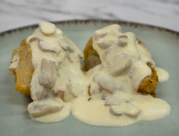istock Fish filets with a mushrooms creamy sauce 2161217942