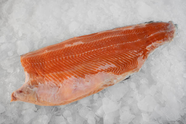 istock Top view of a large trout steak on ice. 2161219421