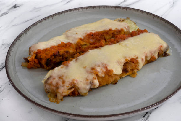 istock Two fish filets with tomato sauce and gratin cheese 2161219972