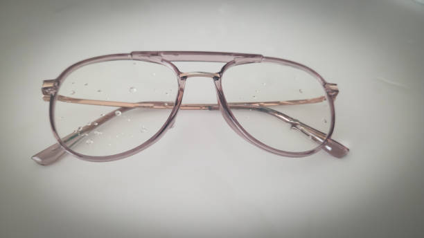 Vintage style glasses and water drops on it with white isolated background.