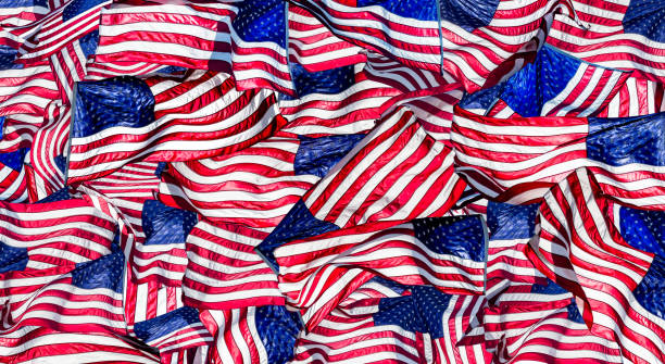 istock Large group of shiny American flags background 2161226224