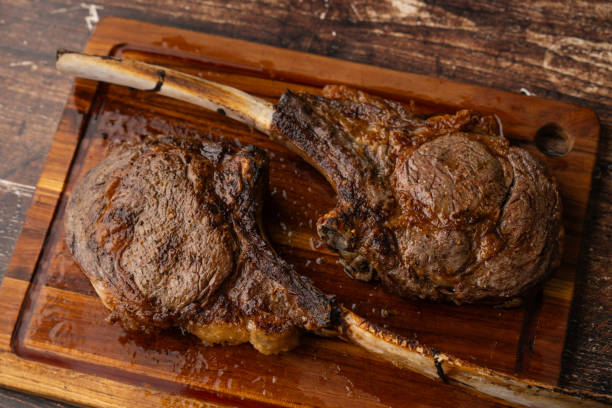 istock grilled tomahawk steak on cutting board 2161227635