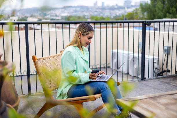 istock Woman using her laptop for doing her payments online 2161227730