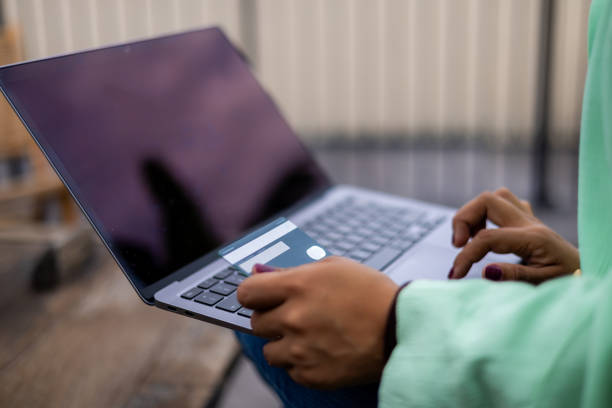 istock Woman using her laptop for doing her payments online 2161227765