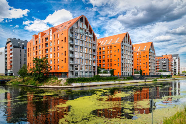 Beautiful new residential houses on the Motlawa river embankment in Gdansk. House development in Poland