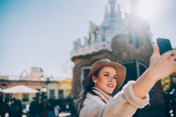 istock Young woman in Barcelona taking selfie 2161229400